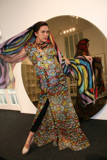 Indigenous comedienne Simone Saunders of Newtown modelled a dress, neck piece and scarf by Melbourne-based designer Roopa Pemmaraju. Ms Pemmaraju, who was exhibiting her collection at Mercedes-Benz Fashion Week, brings together the long tradition of textiles and natural fibres of her Indian heritage, with designs by Australian Indigenous artists. She is a Fair Trade supporter and brings a strong ethos of social equity and respect into her fashion business.