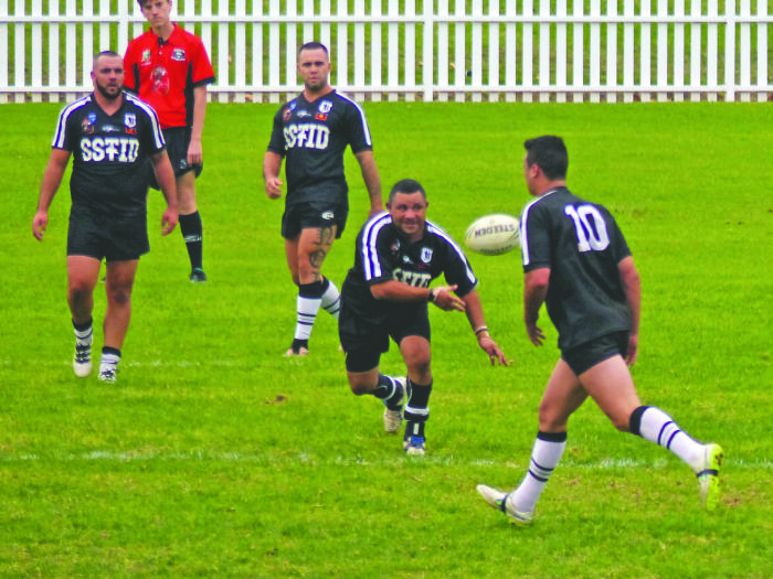 A decoy run by Nelson sets up an All Blacks attacking play. Photo: Vangeli Kollias