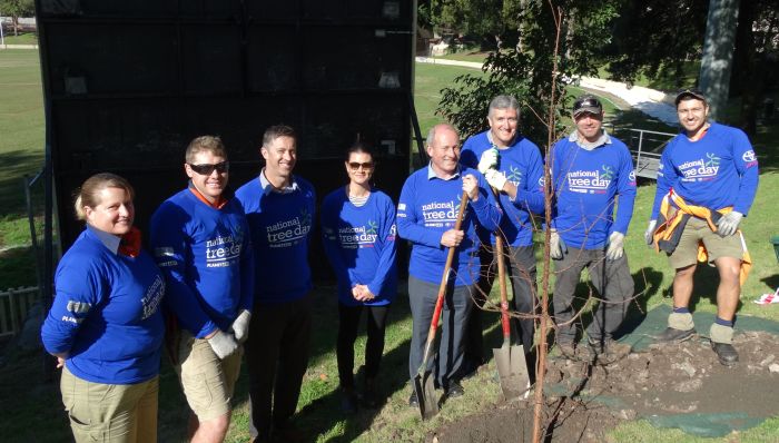 Planting the first of the trees in a new campus planting program on National Tree Day (31 July) Photo: Supplied