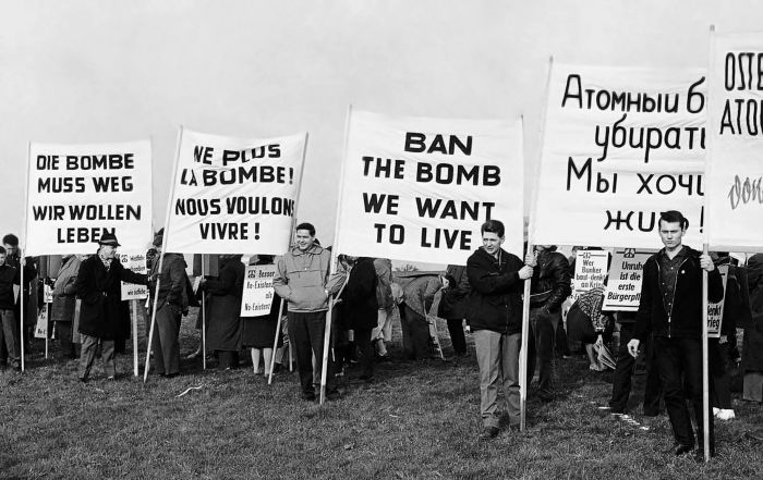 Demonstrators displaying signs in German, French, English, and Russian near a future rocket range in Bavaria, Germany, 1961. Photo: AP Photo/Lindlar