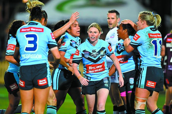 Captain Maddie Studdon (centre) with the victorious Women’s NSW Blues. Photo: NRL Photos
