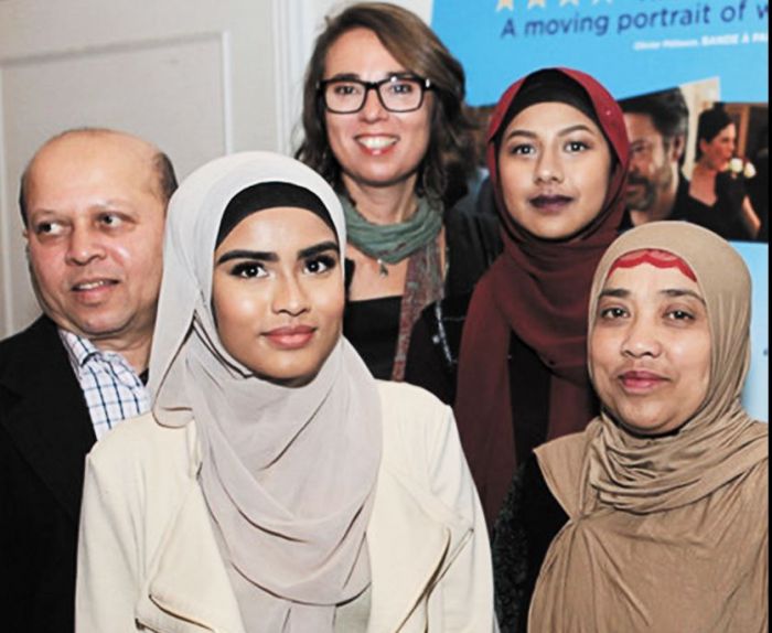 Director Michi Marosszeky pictured with Rohingyan refugee Zainab and her family and friends at the Woven Threads launch. Zainab, who featured in an episode, was born in Malaysia but came to Australia with her parents at the age of 3 and now, at the age of 16, is thankful for the journey her parents made to give her a safer life. Image: supplied